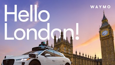 A Waymo Jaguar I-PACE autonomous vehicle in front of the Palace of Westminster in London.